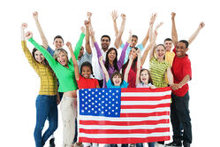 Cheerful group holding American flag.