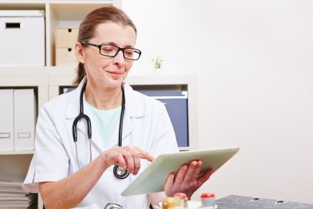 doctor with tablet